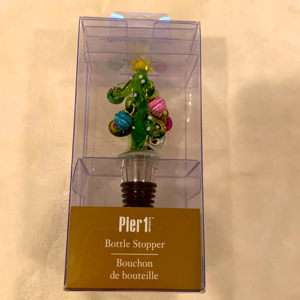 Glass Christmas tree bottle stopper. Bell ornaments move around. Brand new!!